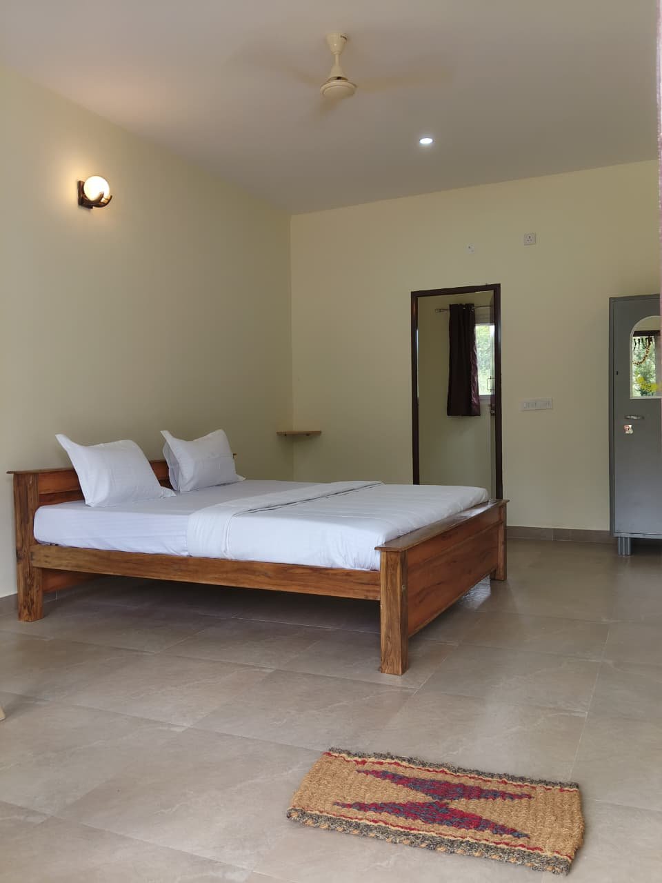 Estate View Room with wooden bed and fresh linen