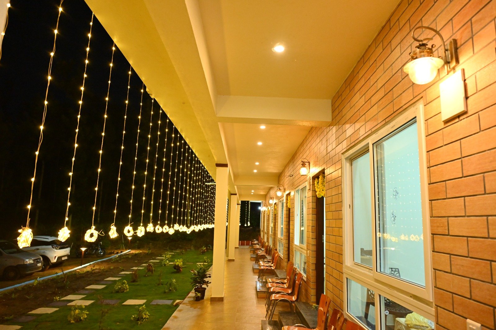 Veranda strung with warm lights at night